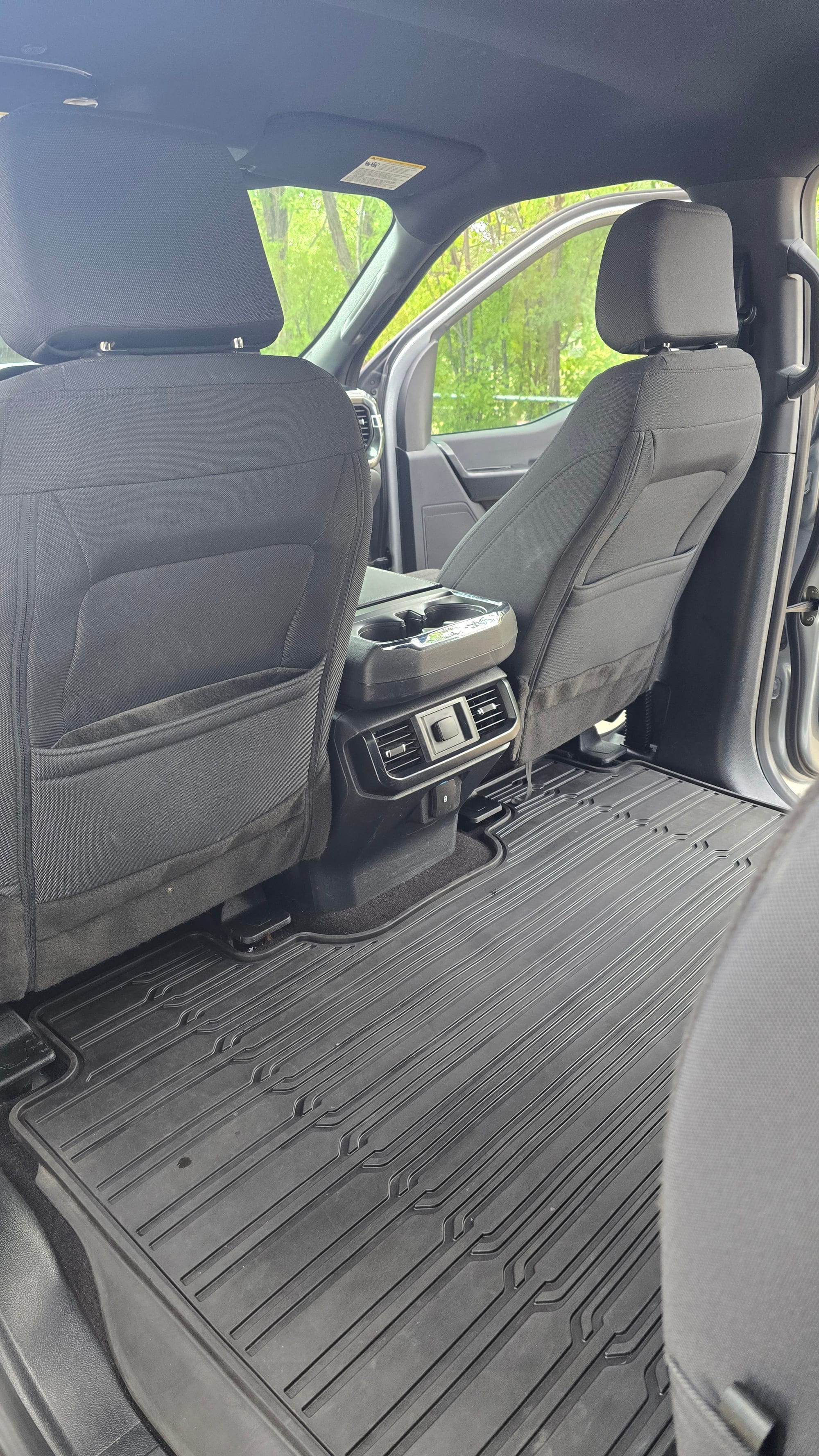 Full Service detail — driver-side interior after shampoo, extraction, and conditioning