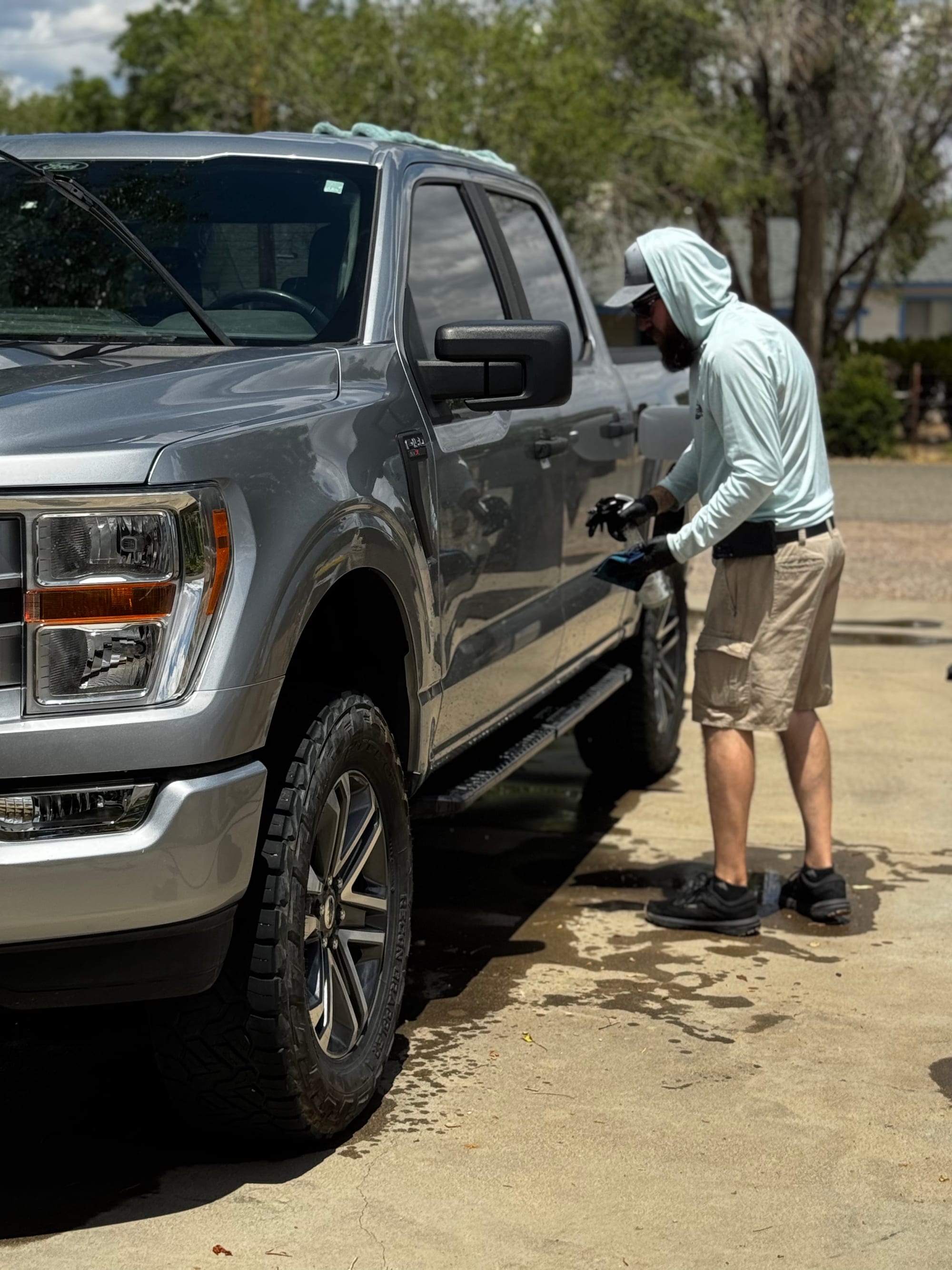 Clay-towel paint decontamination on a Ford F-150 door