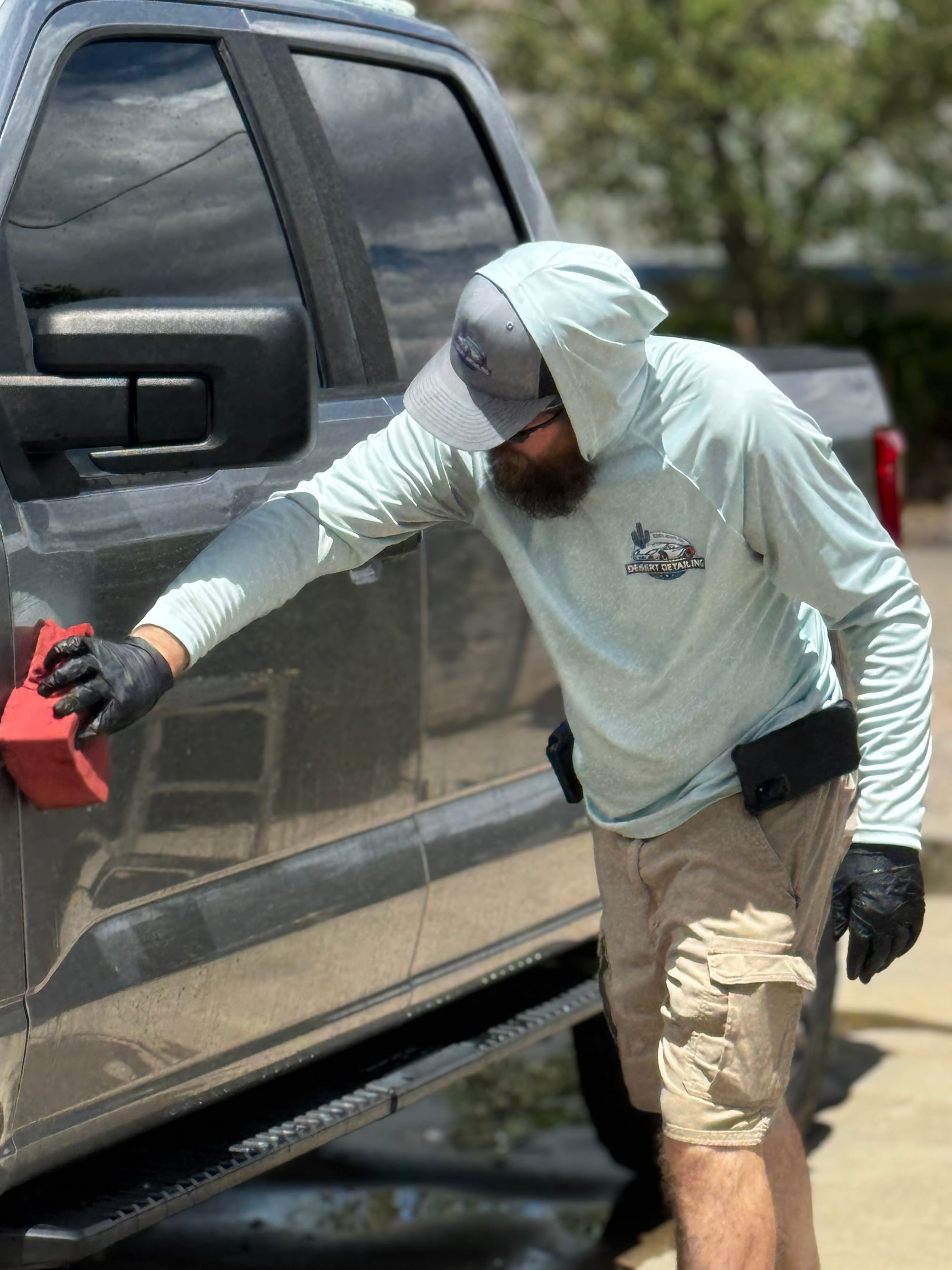 Foam wash being applied to the side of a Ford F-150