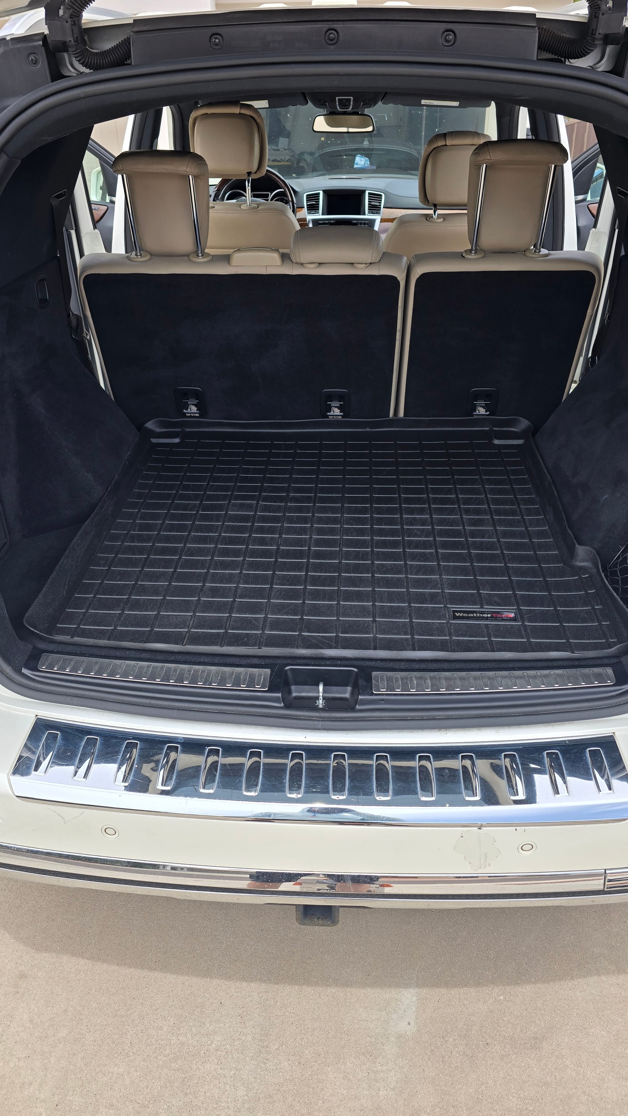 Clean cargo area of a Mercedes-Benz SUV after detailing